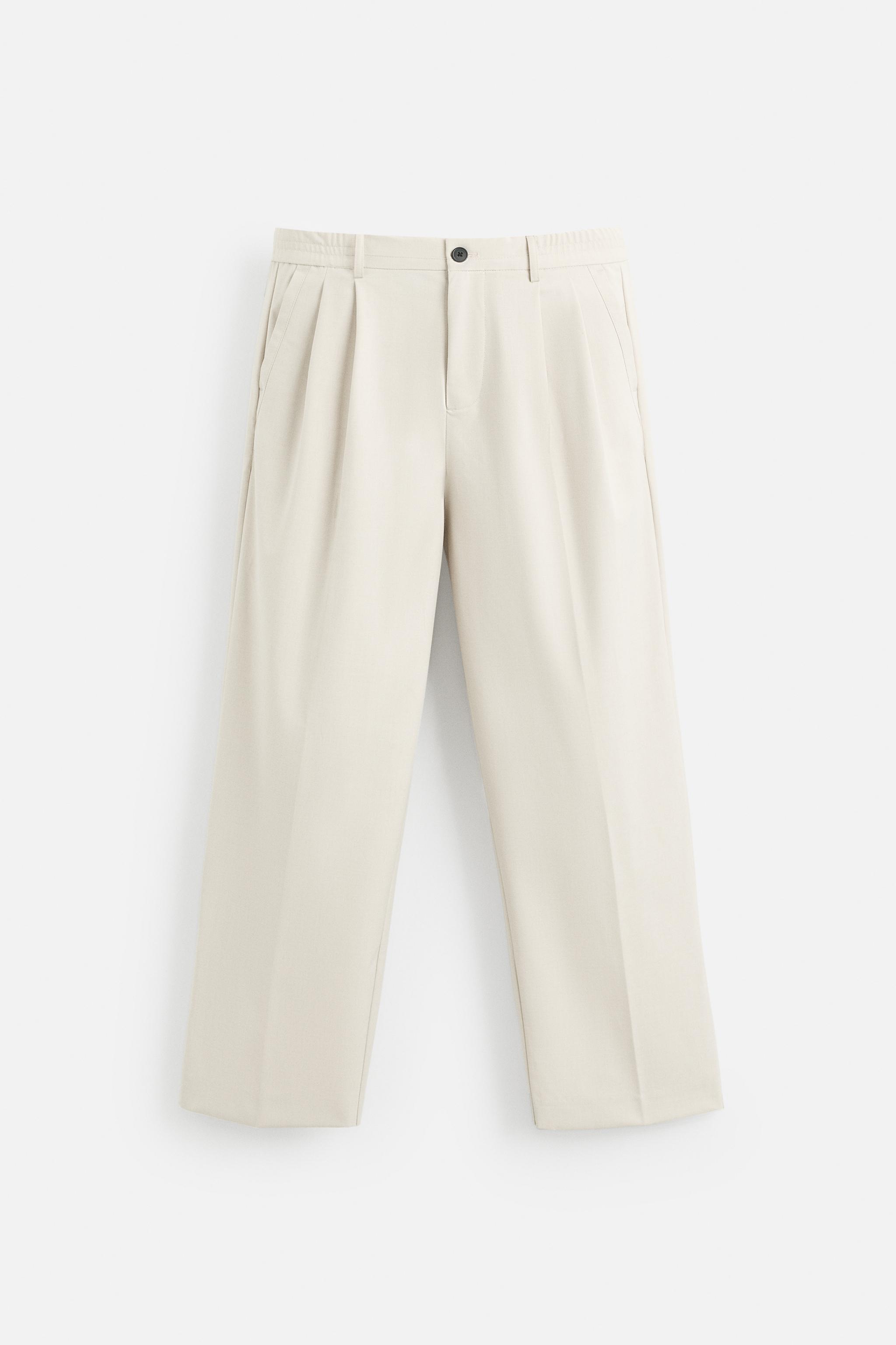 PANTALON COUPE LARGE À PLIS